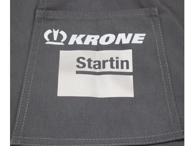 Krone bib and braces. OEM. Part No 209026900 - 30.  Krone bib and braces. Farming boilersuit. Green bib and braces. Krone merchandise. Krone dungarees. Protective work wear. Green Krone coveralls. Farming workwear. Krone protective workwear. Online shop. click & collect. Krone dealer. the power of green.