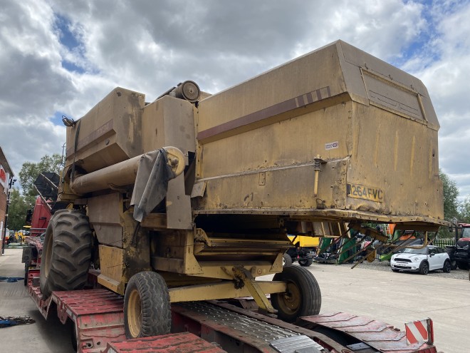 NewHollandTX 34 C/W 20' Header and trailer